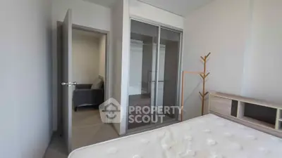 Modern bedroom with sleek wardrobe and minimalist decor