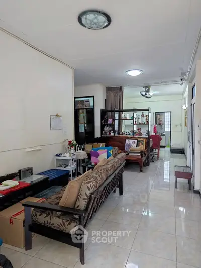 Spacious living room with modern decor and ample natural light