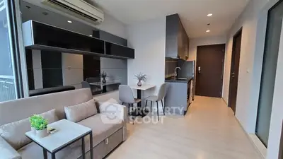 Modern living room with sleek kitchen in open layout apartment