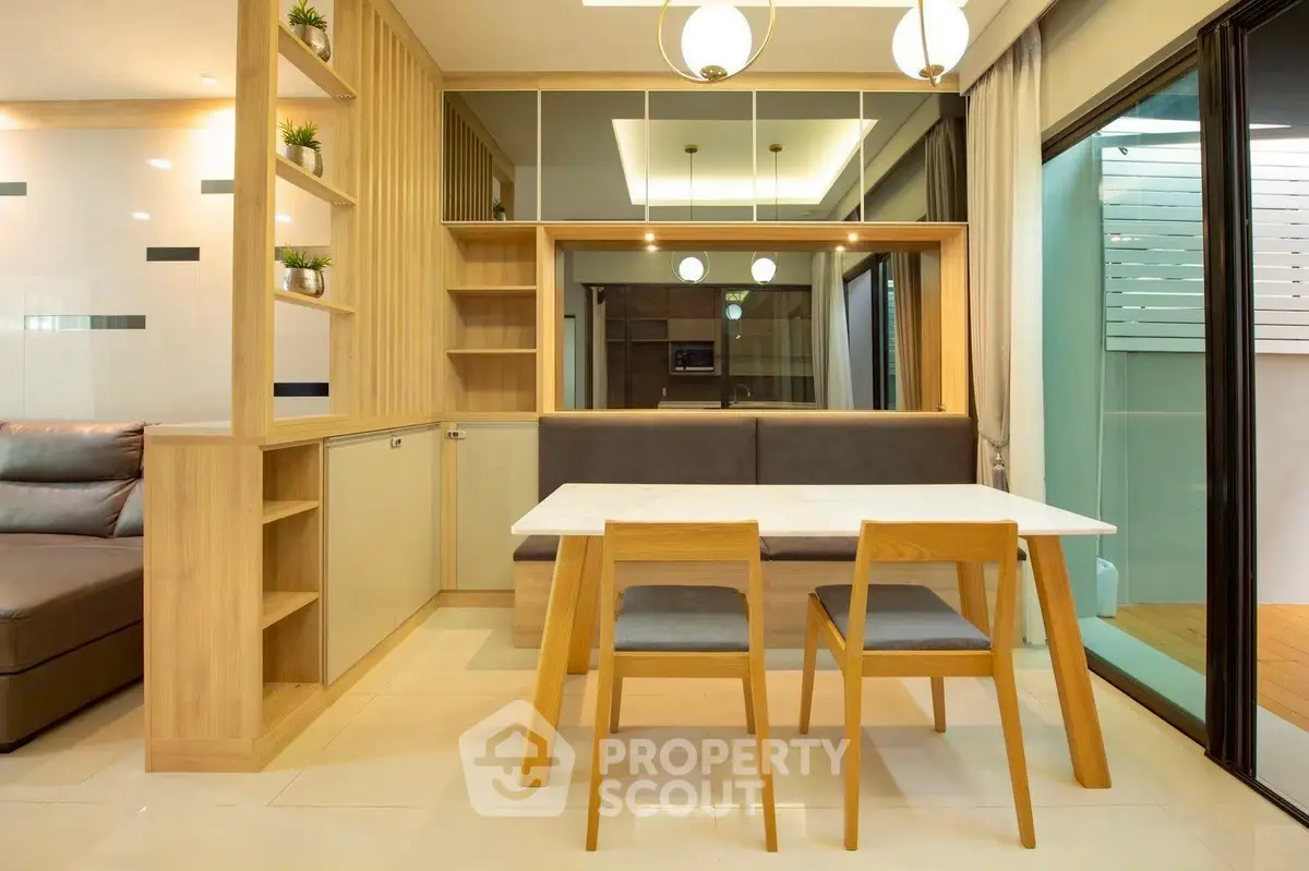 Modern dining area with wooden furniture and large mirror in stylish apartment.