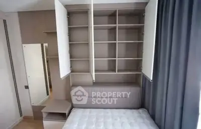 Modern bedroom with built-in storage and stylish decor