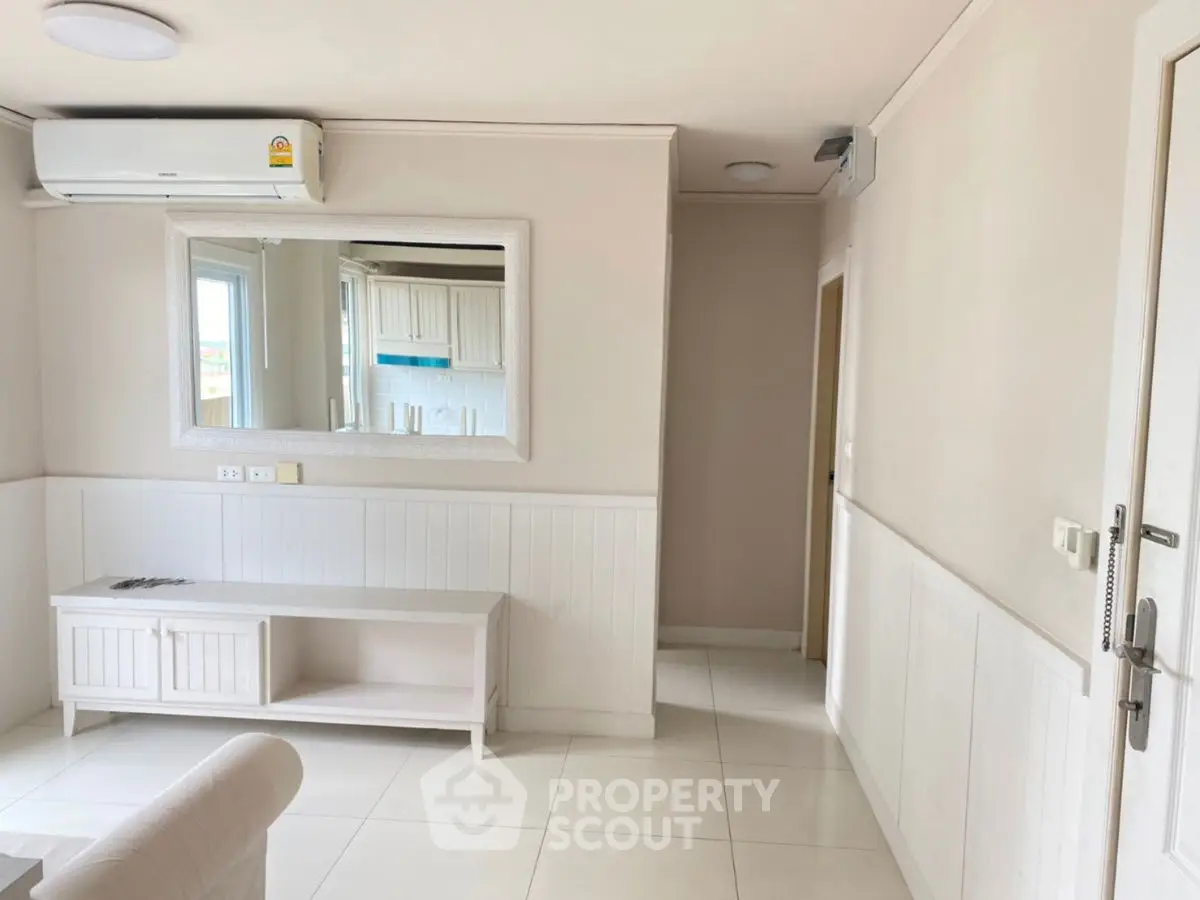 Bright and airy living room with modern air conditioning and stylish decor