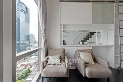 Modern living room with city view and stylish furniture