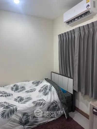 Cozy bedroom with modern air conditioning and stylish decor