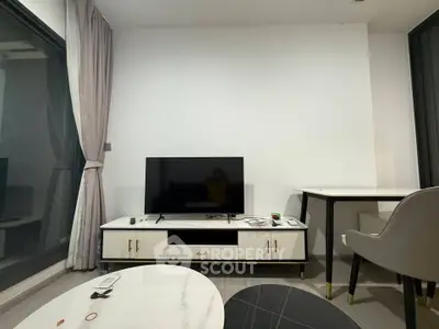 Modern living room with sleek TV stand and elegant furniture, perfect for contemporary urban living.