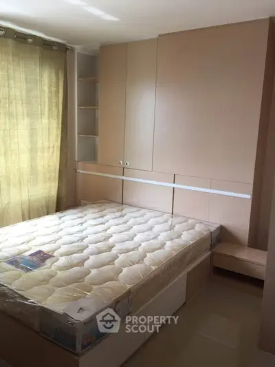 Modern bedroom with built-in storage and natural light