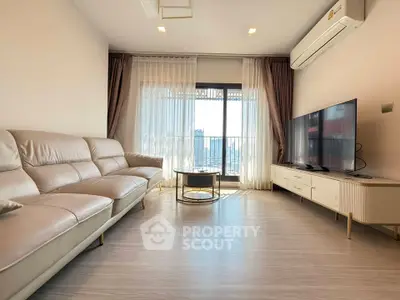 Modern living room with sleek furniture and city view balcony