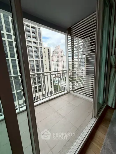 Modern balcony with city view in high-rise apartment