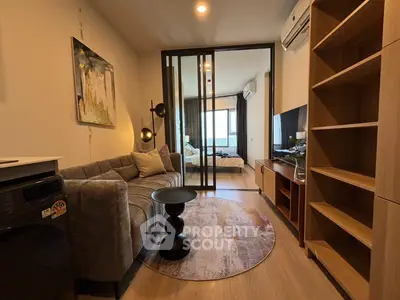 Modern living room with stylish decor and cozy ambiance in a contemporary apartment.