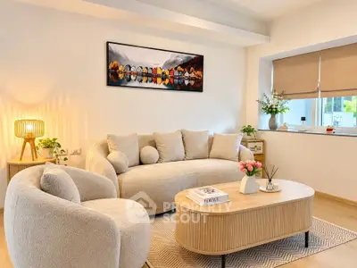 Modern living room with cozy beige furniture and stylish decor