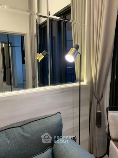 Elegant living room with modern floor lamp and stylish curtains