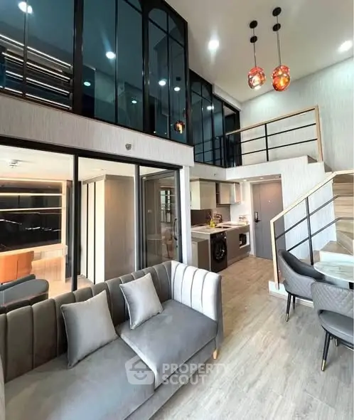Modern duplex living room with high ceilings and stylish decor