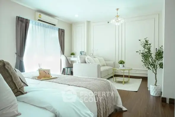 Modern studio apartment with cozy living area and elegant decor
