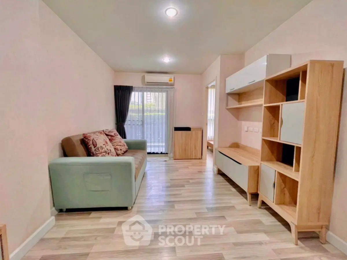 Modern living room with stylish furniture and natural light, perfect for relaxation and entertainment.