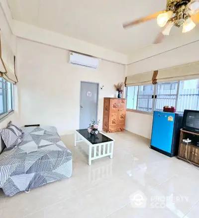 Spacious living room with modern decor and natural light