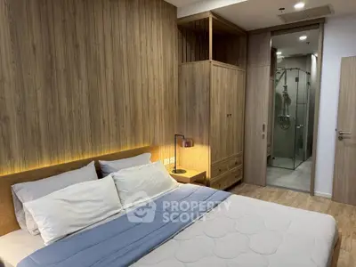 Modern bedroom with wooden accents and ensuite bathroom