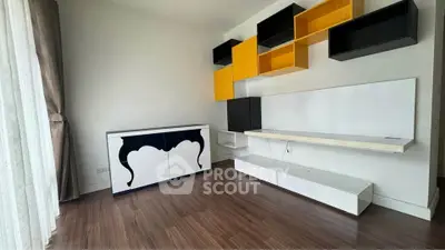 Modern living room with stylish shelving and elegant flooring