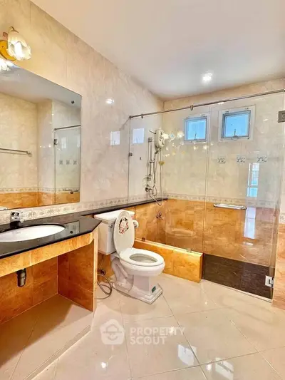 Spacious bathroom with modern fixtures and elegant tile design