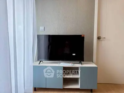 Modern living room with sleek TV stand and contemporary decor