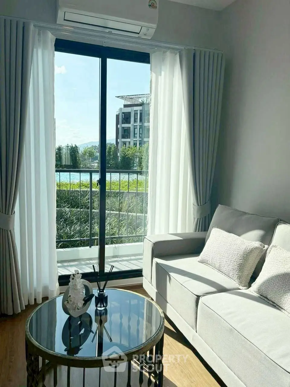 Bright living room with modern sofa and balcony view