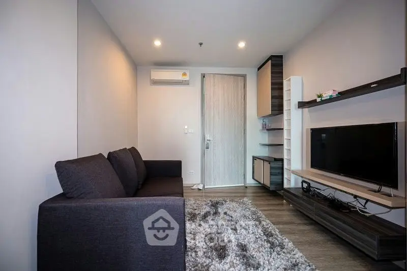 Modern living room with sleek furniture and cozy ambiance, perfect for relaxation and entertainment.