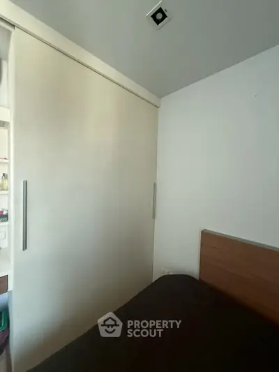 Cozy bedroom with sliding closet doors and modern design