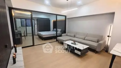 Modern open-plan living room with sleek design and cozy ambiance