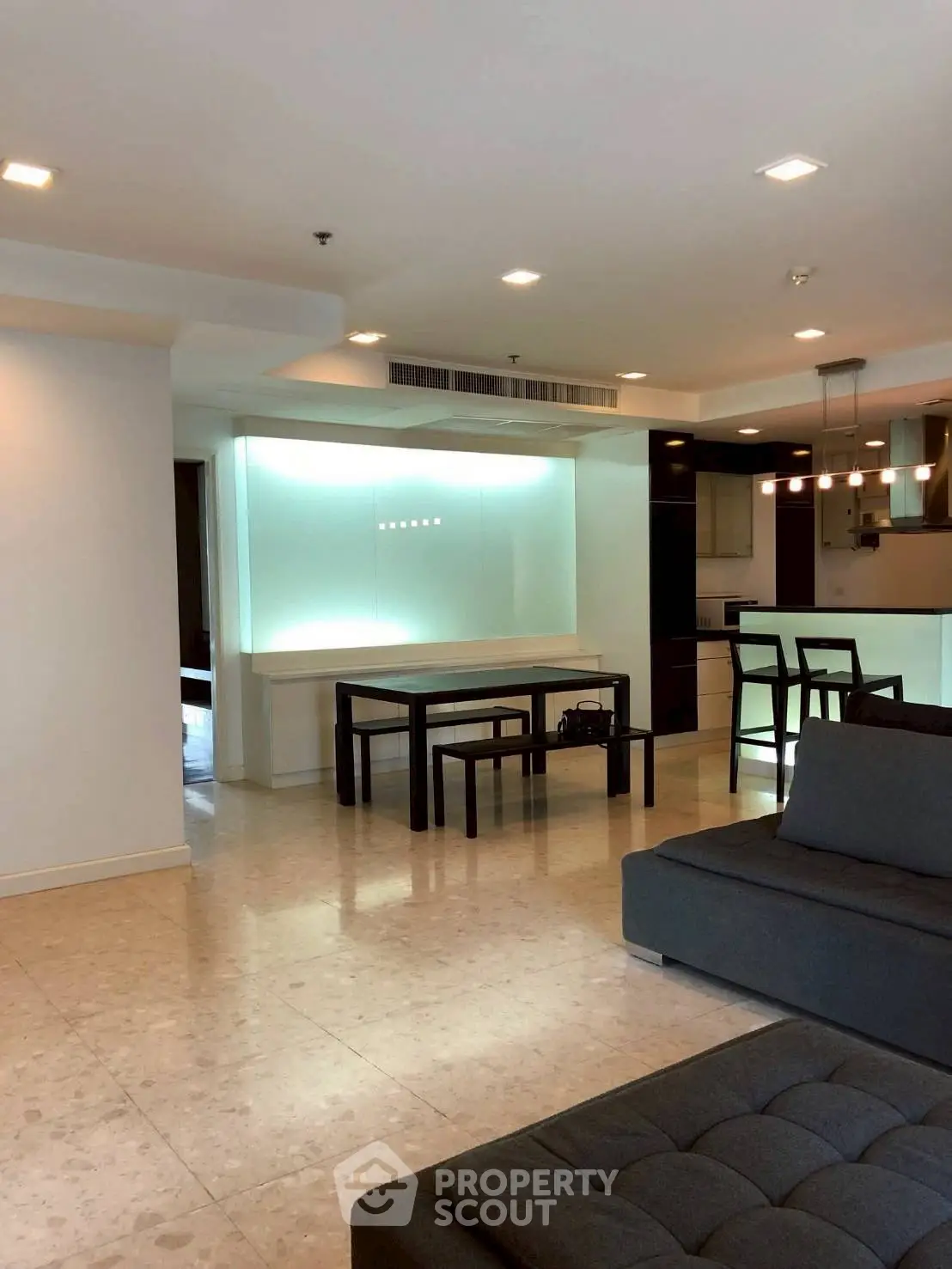 Spacious modern living room with open layout and sleek furniture