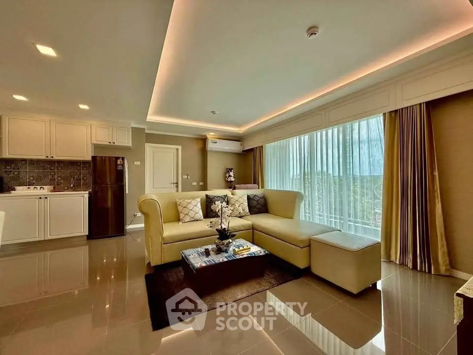 Luxurious living room with modern decor and large windows offering natural light and scenic views.