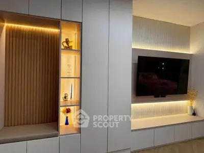 Modern living room with built-in shelving and ambient lighting