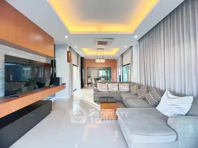 Spacious modern living room with elegant lighting and stylish furniture