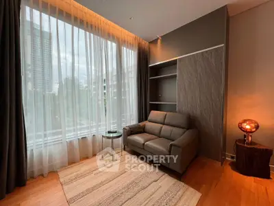 Modern living room with large window and stylish furniture