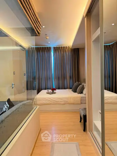 Luxurious bedroom with modern design and ambient lighting, featuring a cozy bed and elegant decor.