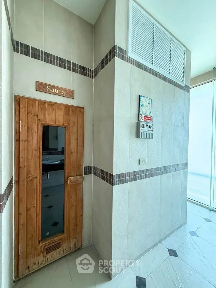 Luxurious building with sauna room offering relaxation and wellness amenities.