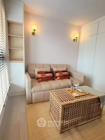 Cozy living room with stylish sofa and modern lighting, perfect for relaxation.