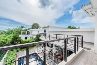 Luxurious modern villa with private pool and expansive balcony offering stunning views.