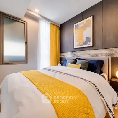 Modern bedroom with stylish decor and natural light