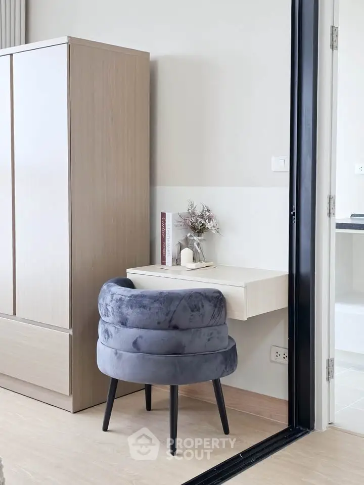 Modern study nook with plush chair and sleek desk in stylish apartment