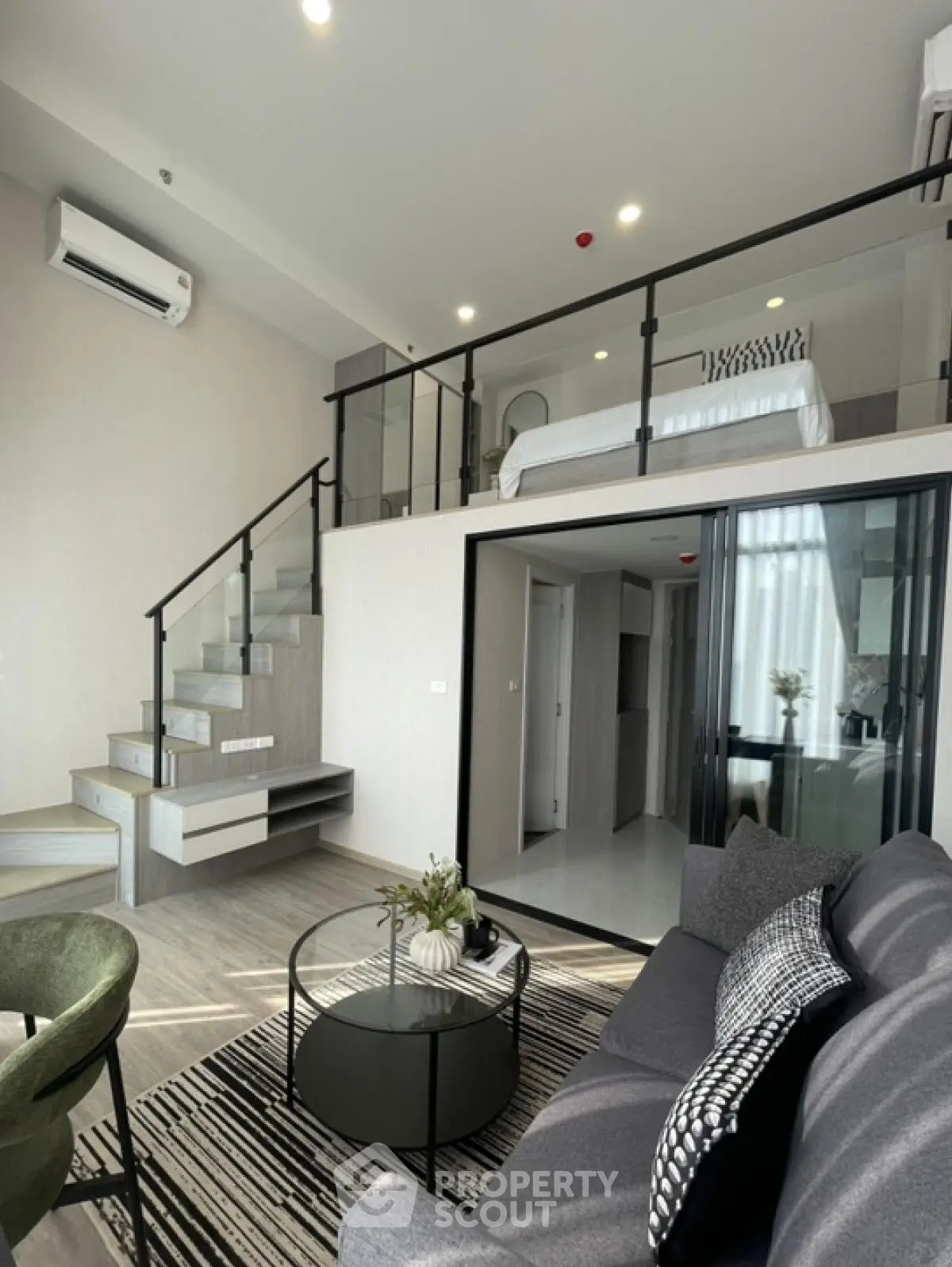 Modern loft apartment with stylish living room and mezzanine bedroom
