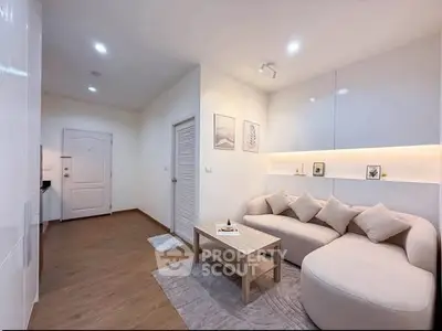 Modern living room with cozy sofa and stylish decor in a contemporary apartment.
