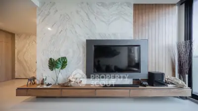 Modern living room with sleek TV setup and elegant decor