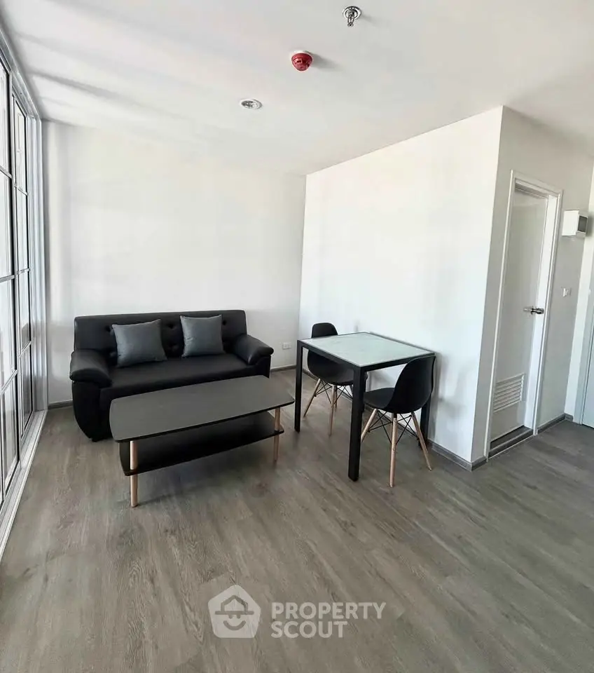 Modern minimalist living room with sleek furniture and natural light