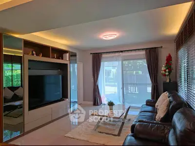 Spacious living room with modern decor and large window view