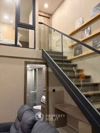 Modern loft apartment with stylish staircase and cozy living area