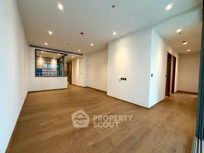 Spacious modern living room with open layout and wooden flooring