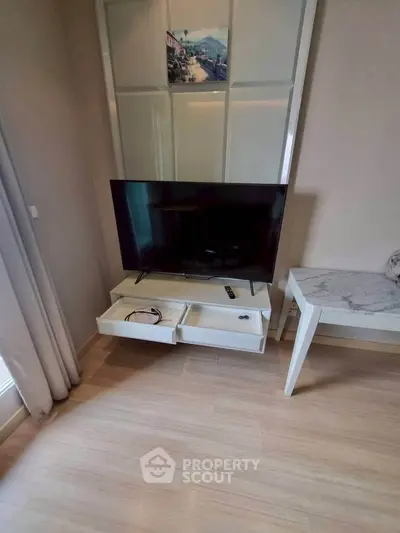 Modern living room with sleek TV setup and stylish furniture