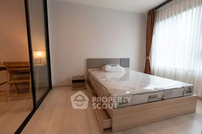 Modern bedroom with natural light and cozy study nook