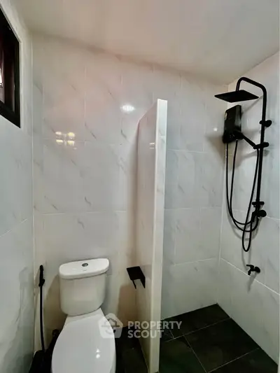 Modern bathroom with sleek shower and elegant tile design