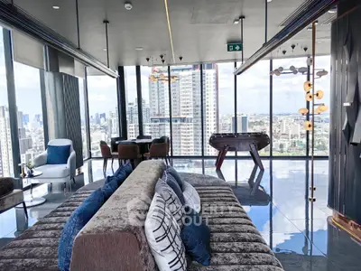 Luxurious high-rise living room with panoramic city views and modern decor