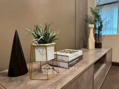 Stylish modern interior with elegant decor and wooden furniture, perfect for contemporary living spaces.